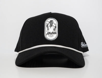 A black baseball cap with a white embroidered patch on the front featuring a skeleton wearing a top hat and the text 'Allstars ATTIRE'. The cap also has a white piping detail along the edge of the brim and a white embroidered logo on the side.